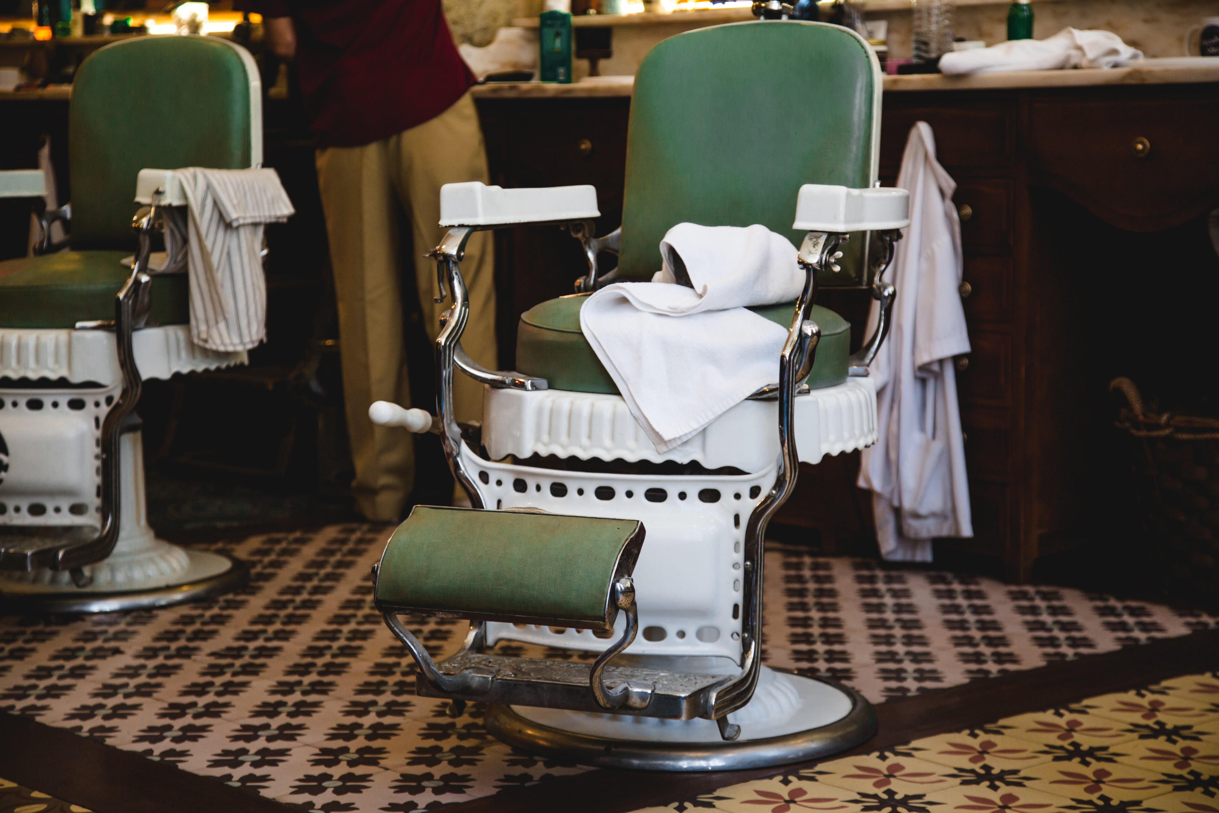 pair-of-green-and-white-chairs-in-barbershop.jpg