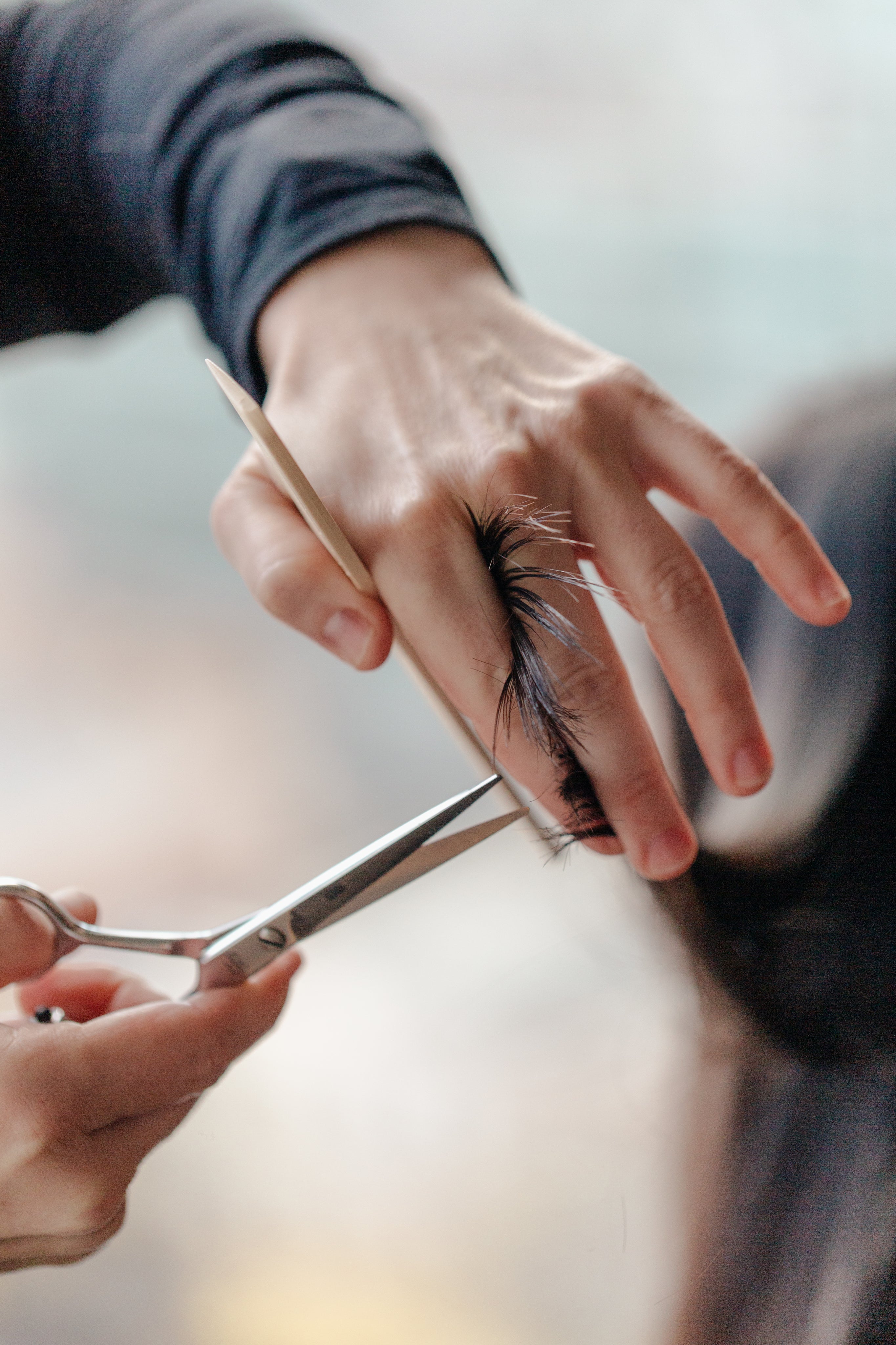 stylist-trimming-a-woman-s-hair.jpg